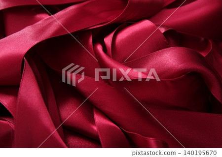 Red satin ribbons in a messy mess texture Red satin ribbons in a messy mess texture 140195670