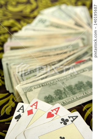 dollar notes and poker cards, gambler tools dollar notes and poker cards, gambler tools 140195687