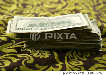 Many dollar notes over tablecloth Many dollar notes over tablecloth 140195763
