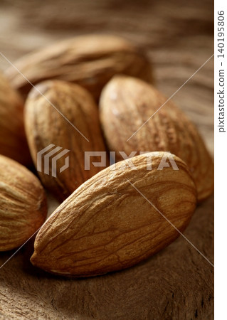 Almond macro over wood background Almond macro over wood background 140195806