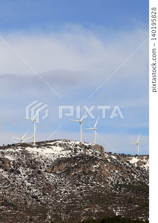 aerogenerator electric windmills on snow mountain 140195828