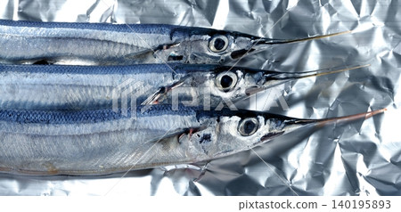 three needle fish, uncooked macro studio shot three needle fish, uncooked macro studio shot 140195893