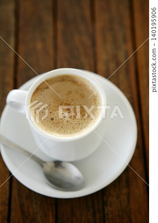 Coffe with milk white cup over teak wooden Coffe with milk white cup over teak wooden 140195906