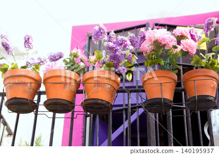flowers balcony in pink and purple at Ibiza flowers balcony in pink and purple at Ibiza 140195937