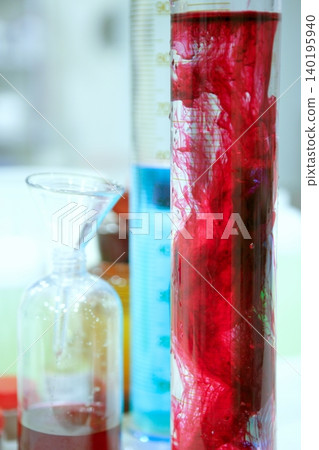 Laboratory stuff, glass cylinder, colorful liquids Laboratory stuff, glass cylinder, colorful liquids 140195940