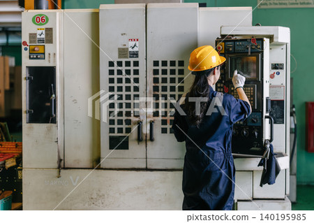 Professional young Asian Engineer woman working control operate CNC machine in industry factory Professional young Asian Engineer woman working control operate CNC machine in industry factory 140195985