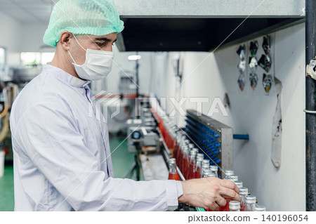 Stuff worker European labor working in drinks plant factory in hygiene food safety standard uniform Stuff worker European labor working in drinks plant factory in hygiene food safety standard uniform 140196054