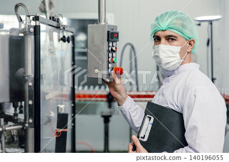 Factory engineer technician working machine operate setting in food and drink factory with hygiene Factory engineer technician working machine operate setting in food and drink factory with hygiene 140196055
