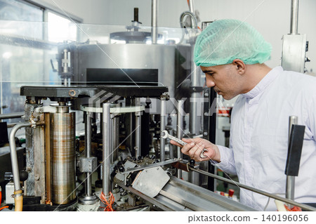 Factory engineer technician working fix service machine in food and drink factory with hygiene 140196056