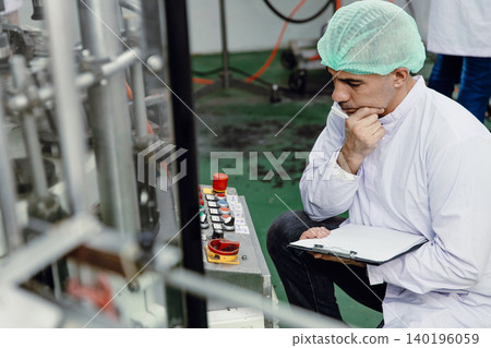 Factory engineer technician working machine operate setting in food and drink factory with hygiene 140196059