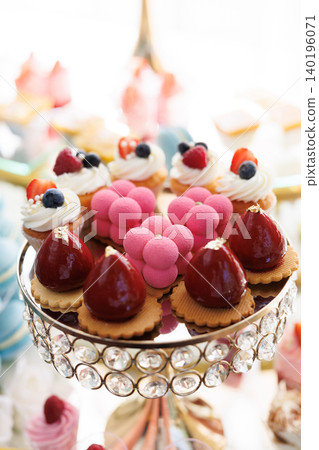 Delicious desserts decorating elegant candy bar table for wedding reception Delicious desserts decorating elegant candy bar table for wedding reception 140196071