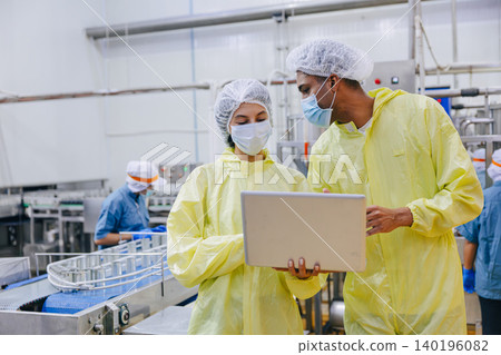 Food hygiene inspector team work examination food production process in line at cannery food factory 140196082