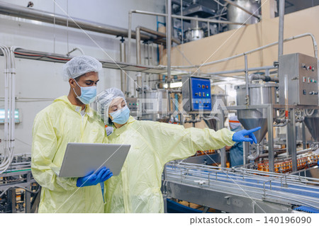 Food hygiene inspector team work examination food production process in line at cannery food factory Food hygiene inspector team work examination food production process in line at cannery food factory 140196090