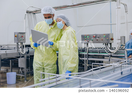 Food hygiene inspector team work examination food production process in line at cannery food factory Food hygiene inspector team work examination food production process in line at cannery food factory 140196092