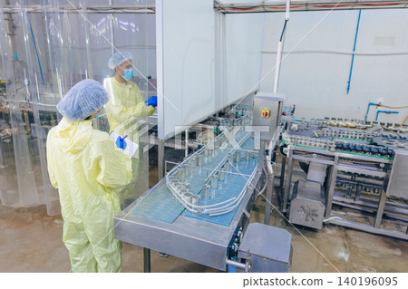 Food hygiene inspector team work examination food production process in line at cannery food factory Food hygiene inspector team work examination food production process in line at cannery food factory 140196095