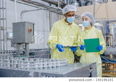 Food hygiene inspector team work examination food production process in line at cannery food factory Food hygiene inspector team work examination food production process in line at cannery food factory 140196101