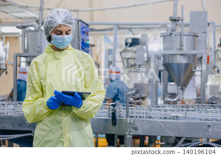 Food hygiene inspector team work examination food production process in line at cannery food factory Food hygiene inspector team work examination food production process in line at cannery food factory 140196104