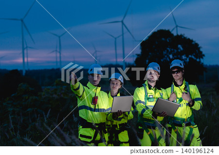 Professional engineer team at night shift. Workers in wind turbine. Technician work survey inspector Professional engineer team at night shift. Workers in wind turbine. Technician work survey inspector 140196124