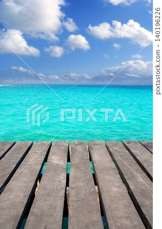 Caribbean wood pier with turquoise aqua sea Caribbean wood pier with turquoise aqua sea 140196226
