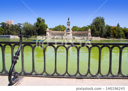 Retiro park lake in Madrid with fallen angel Retiro park lake in Madrid with fallen angel 140196245