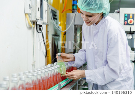 Product quality control stuff check examination product beverage at production line in drink factory Product quality control stuff check examination product beverage at production line in drink factory 140196310