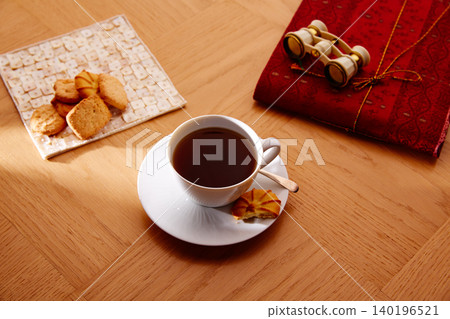 Morning breakfast coffee with vintage red notebook Morning breakfast coffee with vintage red notebook 140196521