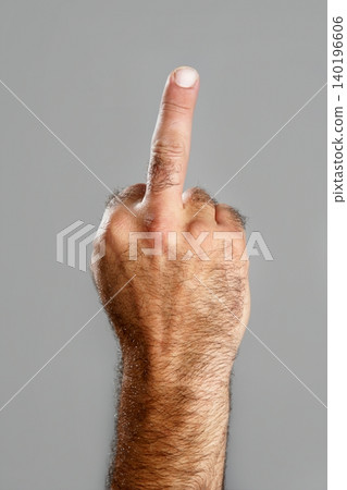 Hairy man hand closeup obscene expression Hairy man hand closeup obscene expression 140196606