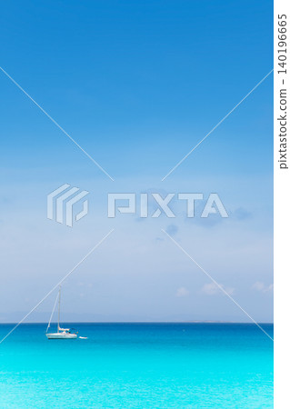 Balearic mediterranean turquoise sea with sailboat Balearic mediterranean turquoise sea with sailboat 140196665