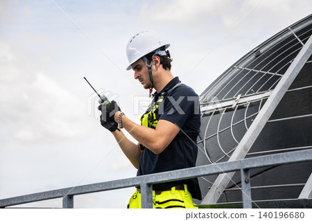 Professional Worker Servicing HVAC building cooling tower, Industry air conditioner service Professional Worker Servicing HVAC building cooling tower, Industry air conditioner service 140196680