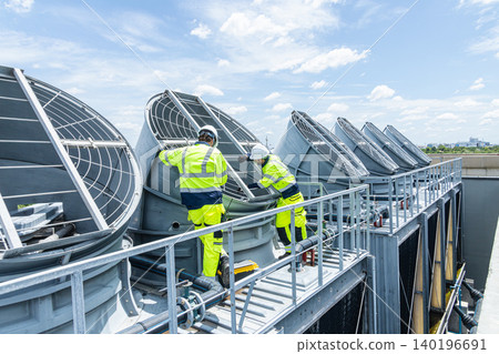 Professional Worker Teamwork Servicing HVAC building cooling tower, Industry air conditioner service Professional Worker Teamwork Servicing HVAC building cooling tower, Industry air conditioner service 140196691