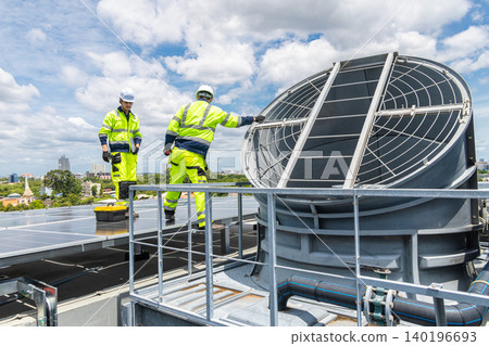 Professional Worker Teamwork Servicing HVAC building cooling tower, Industry air conditioner service Professional Worker Teamwork Servicing HVAC building cooling tower, Industry air conditioner service 140196693