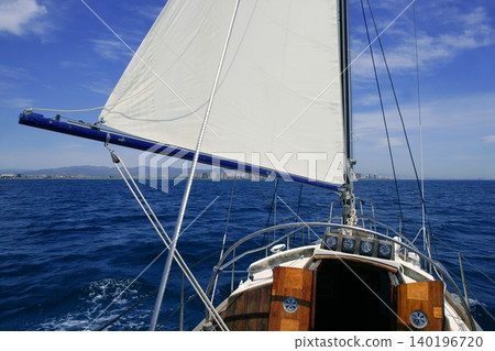 Sailboat sailing blue sea on sunny summer day Sailboat sailing blue sea on sunny summer day 140196720
