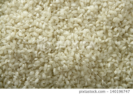 White rice close up texture. Background pattern White rice close up texture. Background pattern 140196747