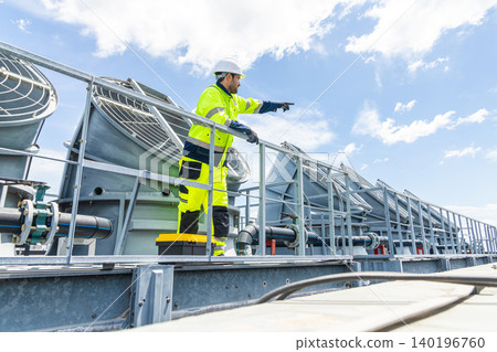 Professional Worker Servicing HVAC building cooling tower, Industry air conditioner service Professional Worker Servicing HVAC building cooling tower, Industry air conditioner service 140196760