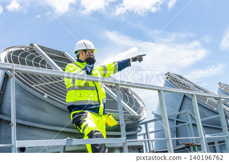 Professional Worker Servicing HVAC building cooling tower, Industry air conditioner service 140196762