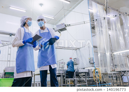 Food hygiene officer inspecting and certifying the cleanliness of fish production product factory, Food hygiene officer inspecting and certifying the cleanliness of fish production product factory, 140196773