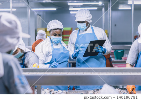 Food hygiene officer inspecting and certifying the cleanliness of fish production product factory, Food hygiene officer inspecting and certifying the cleanliness of fish production product factory, 140196781