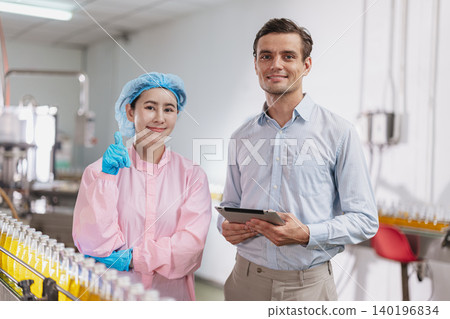 Food and drinks Industry Team Portrait Happy Smile. Line product inspector in beverage factory. Food and drinks Industry Team Portrait Happy Smile. Line product inspector in beverage factory. 140196834