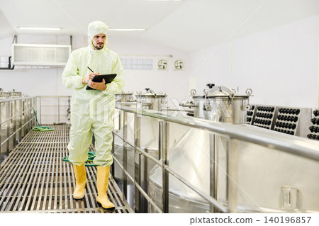 Winemaker professional working in modern large winery factory liquor alcohol drinks industry Winemaker professional working in modern large winery factory liquor alcohol drinks industry 140196857