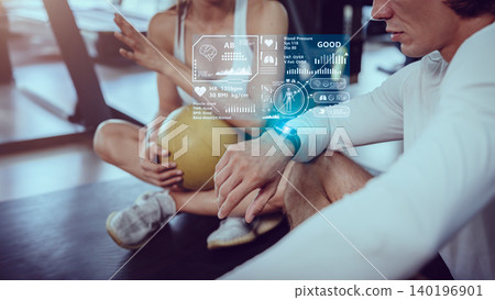 People in health club using Smart Watch tracking health information data display graphic interface overlay People in health club using Smart Watch tracking health information data display graphic interface overlay 140196901
