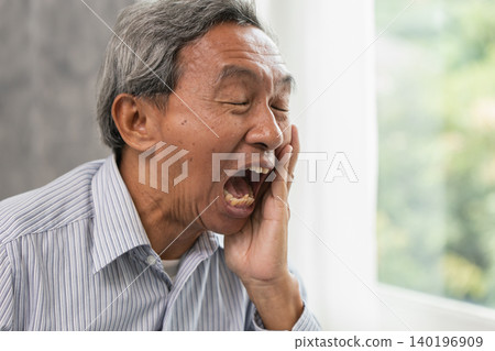 Senior Man Suffering from Toothache and Dental Pain at Home, Elder man dental painful expression Senior Man Suffering from Toothache and Dental Pain at Home, Elder man dental painful expression 140196909