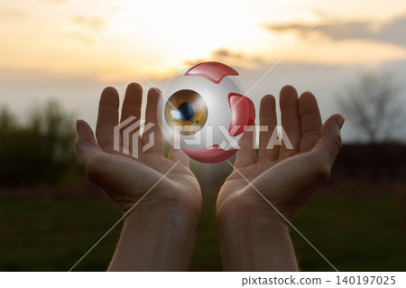 Glowing orb held in the air 140197025