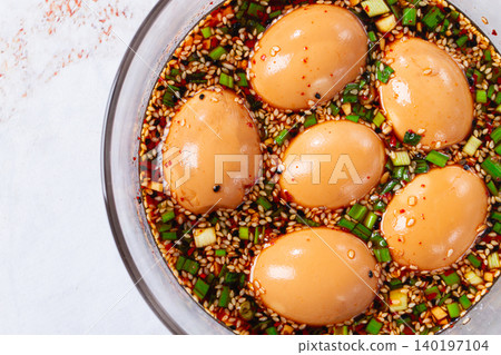 marinated eggs Mayak Gyeran, in a glass bowl,sauce with spices, top view, no people, marinated eggs Mayak Gyeran, in a glass bowl,sauce with spices, top view, no people, 140197104