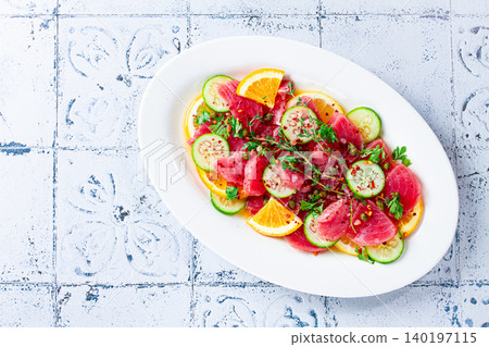 Sicilian tuna crudo, on a white plate, Italian dish, homemade, no people, Sicilian tuna crudo, on a white plate, Italian dish, homemade, no people, 140197115