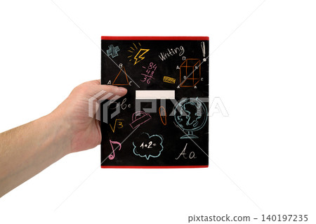 male hand holds a school notebook with drawings on a white background close up view male hand holds a school notebook with drawings on a white background close up view 140197235