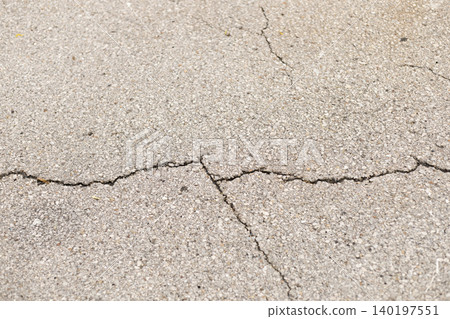 Cracked Asphalt Texture with Damaged Pavement Cracked Asphalt Texture with Damaged Pavement 140197551