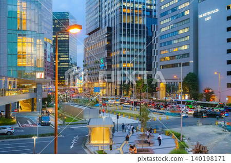 Osaka, Japan - Sep 25 2024, panoramic view of the square and the intersection with busy traffic surrounded by skyscrapers. shopping malls and branded stores, at evening with street light, Osaka, Japan Osaka, Japan - Sep 25 2024, panoramic view of the square and the intersection with busy traffic surrounded by skyscrapers. shopping malls and branded stores, at evening with street light, Osaka, Japan 140198171