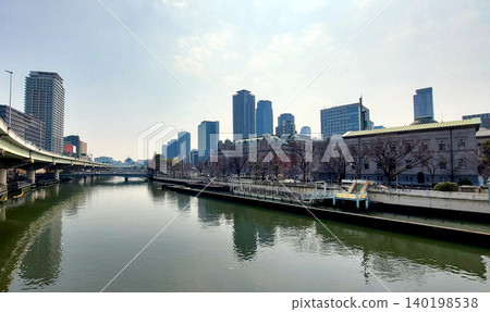 The city of water: Osaka's scenery, including Nakanoshima Park and the skyscrapers of Kitahama and Tenmabashi. 140198538