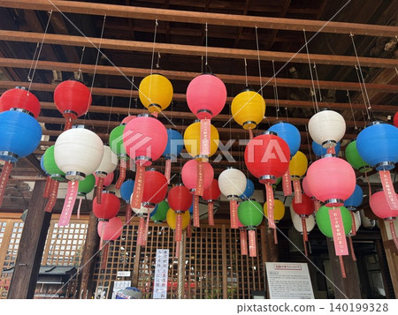 Nara's Ofusa Kannon Lantern Festival: A scene of vibrant, colorful lanterns lined up. 140199328