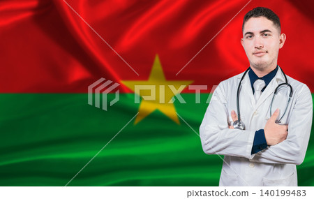 Portrait of medical professional on Burkina Faso flag background. Burkinabe national health system 140199483